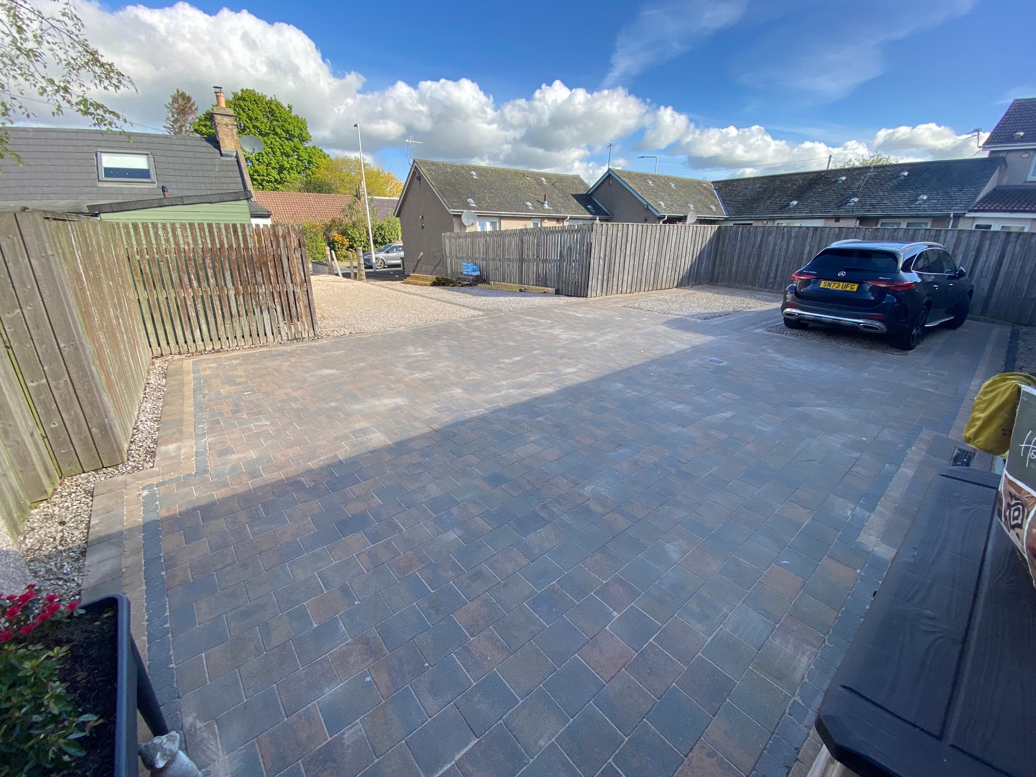 Beautifully restored driveway with pristine block paving and modern landscaping