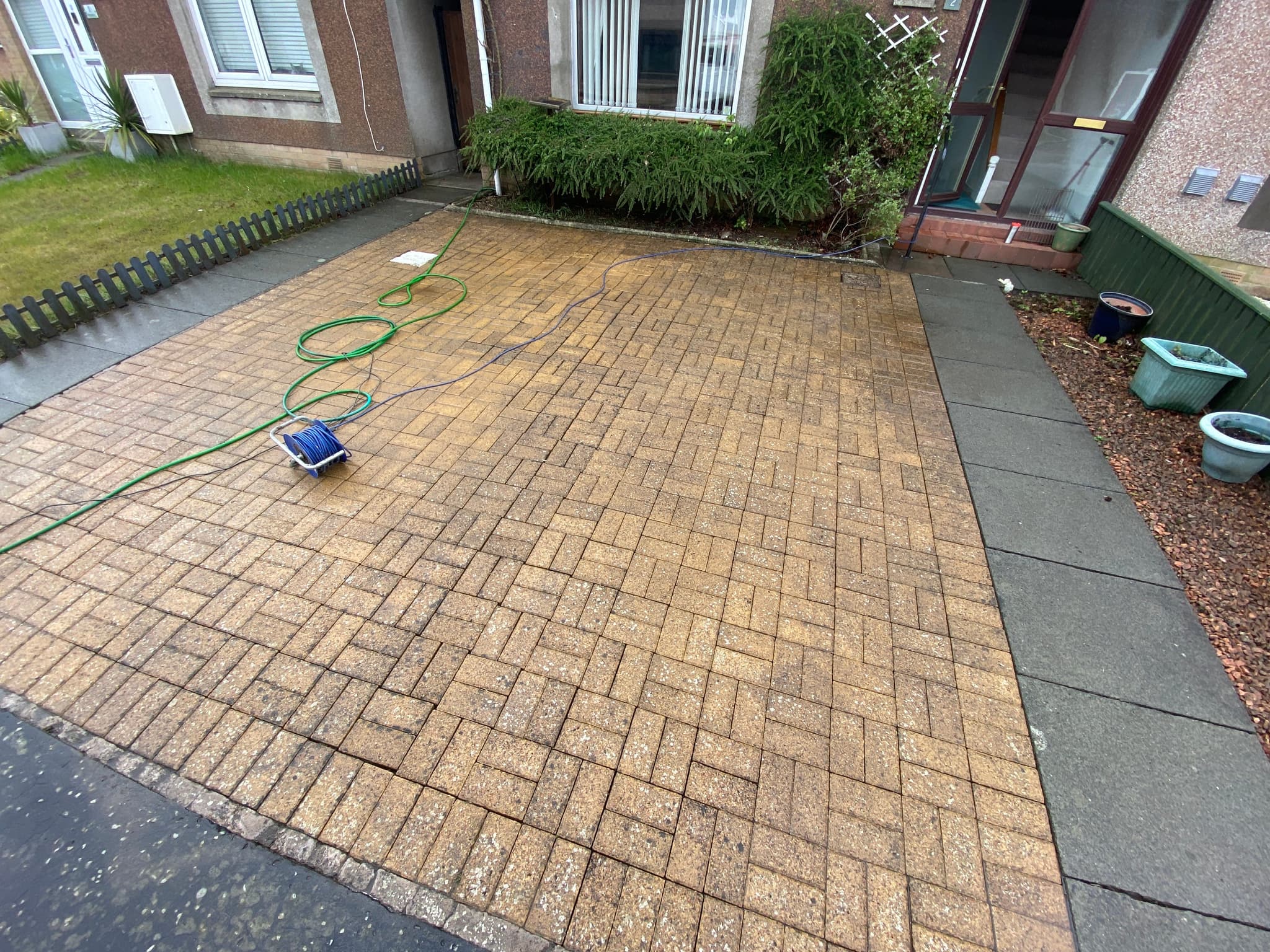Mid-job jet washing on herringbone block paving in Leuchars