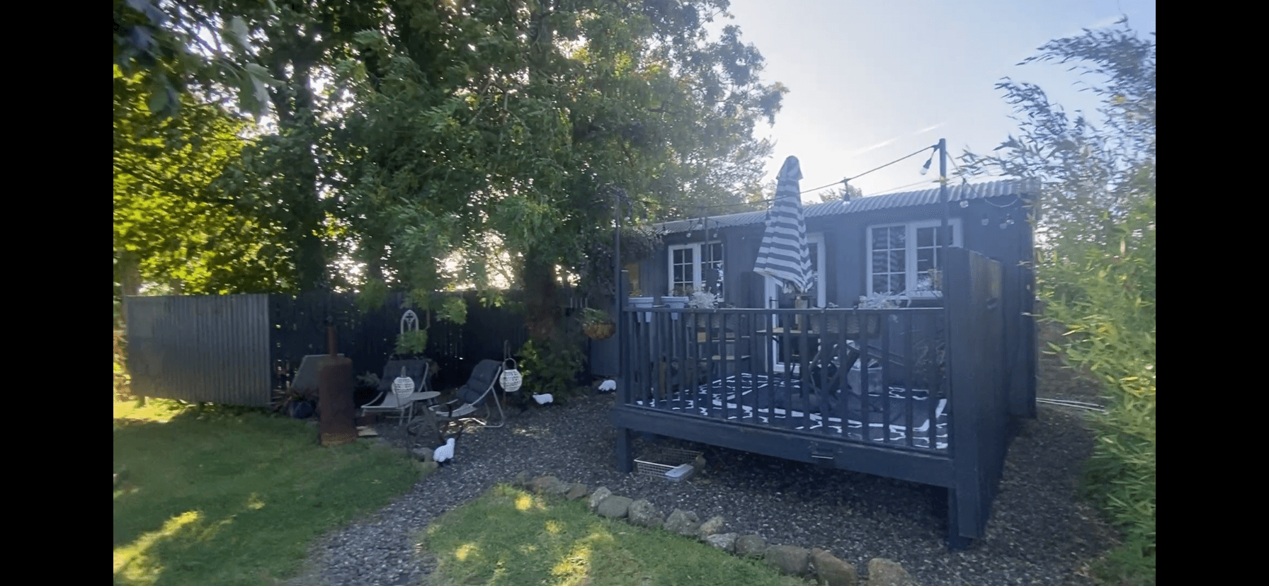 Before painting: Sam's grey shepherd's hut and timber deck in St Andrews